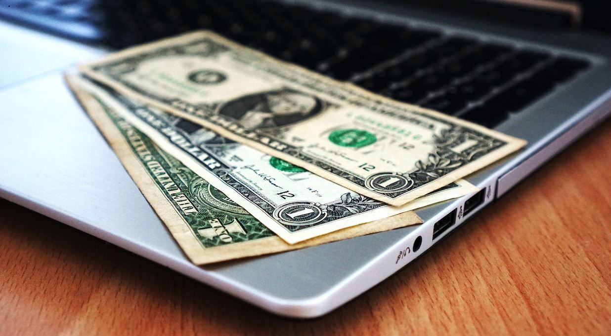 dollar on laptop