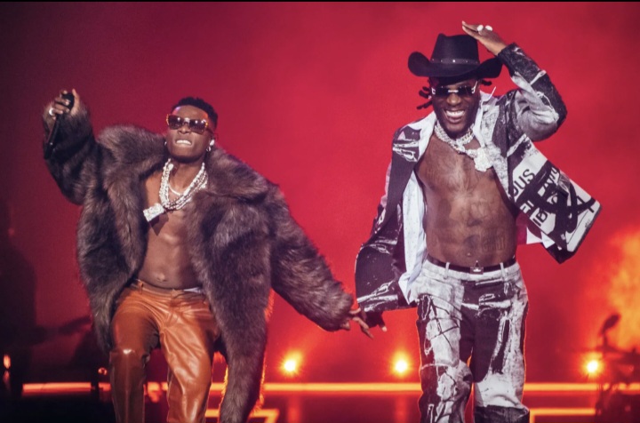 Wizkid and Burna Boy performing on stage 