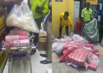 Lagos enforcement officers confiscating red plastic cups and pink plastic bags at Justrite Supermarket in Lekki.