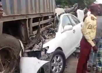 Car crash scene at Olohunsogo Bus Stop in Lagos with police managing traffic.