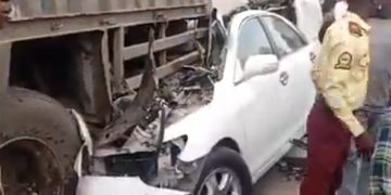 Car crash scene at Olohunsogo Bus Stop in Lagos with police managing traffic.