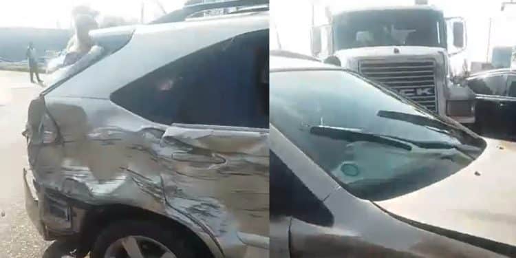 Scene of a road crash involving a truck and jeeps on a busy Lagos street with traffic officers present.