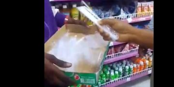 Lagos enforcement team seizing plastic straws and red cups at supermarket