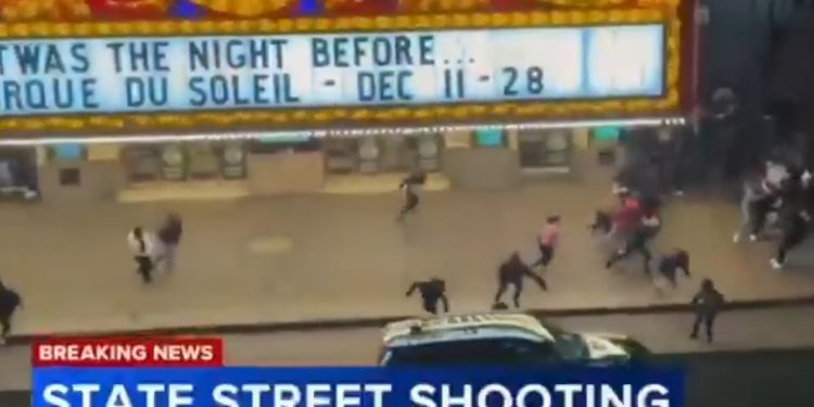 Chicago police tape near the 100 block of South Dearborn Street in the Loop after the fatal shooting of 14-year-old Armani Floyd.