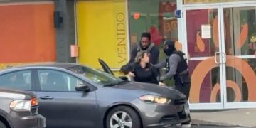 Unmarked SUV and federal agents outside a day care center.