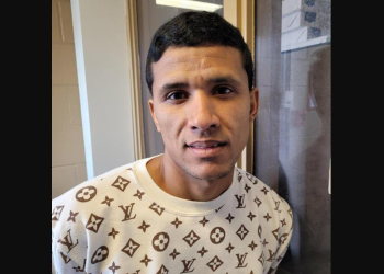 Arrested Venezuelan gang member wearing Louis Vuitton sweater in Chicago custody