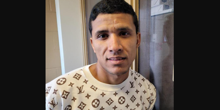 Arrested Venezuelan gang member wearing Louis Vuitton sweater in Chicago custody