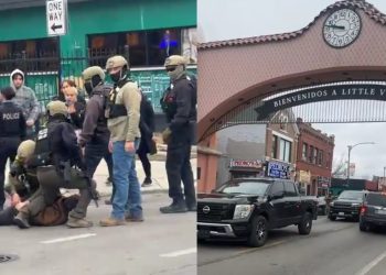 Chicago Police officers standing near federal agents during an arrest on a busy street.