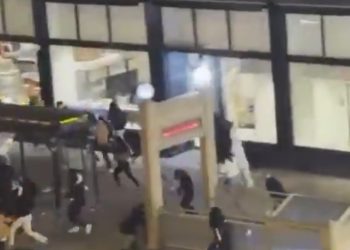 Photo of police responding to the mass shooting and riot near the Chicago Theater marquee after the Christmas tree lighting.
