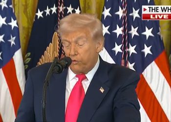 Donald Trump speaking at a podium while critics reference the SNAP food stamp lawsuit.