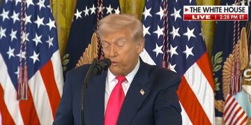 Donald Trump speaking at a podium while critics reference the SNAP food stamp lawsuit.